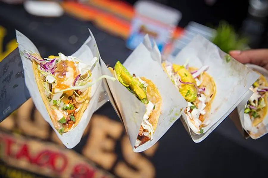 Tacos on paper holders at the Del Mar Taco & Beer Festival